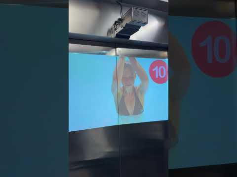 Advertising projector in elevator,  [Video]